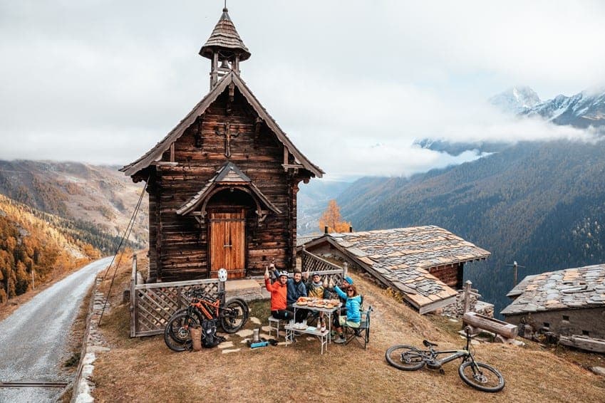 Riding through a historic village in the heart of the Lotschental Valley