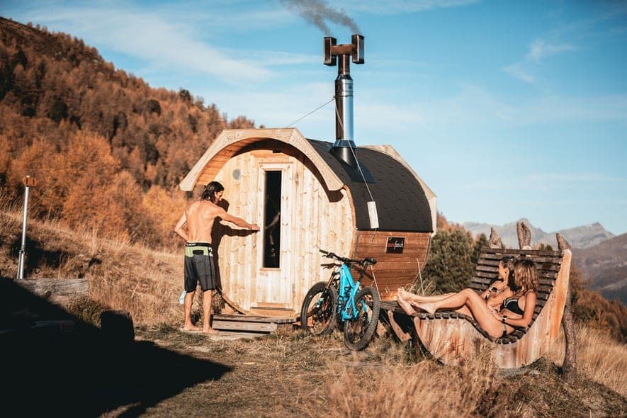 Three people relaxing on an outdoor spa