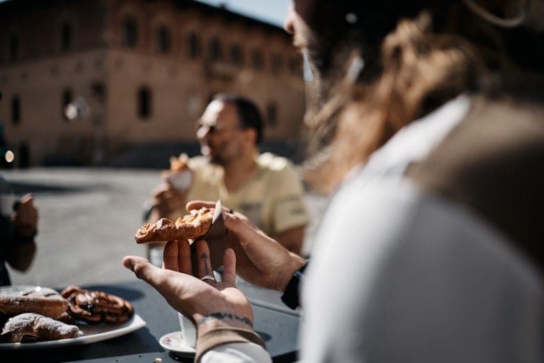 Enjoying a delicious capuccino and Italian pastries at the historic Massa Maritima main square before our guided e-MTB tour