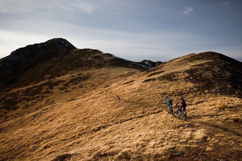 Two riders on a quintessentially alpine trail