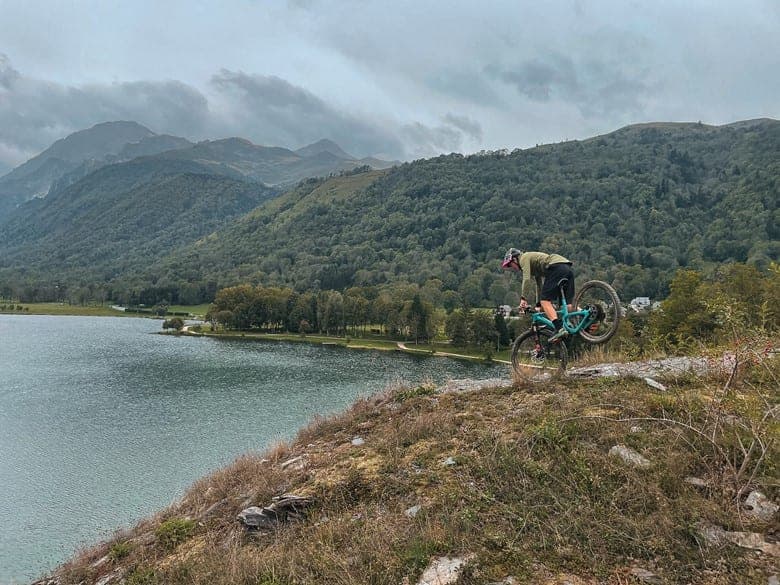Always having fun: Boris doing a stoppie in front of a crystalline lake
